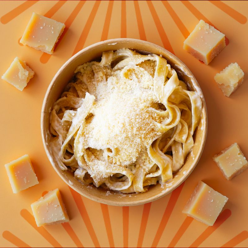 Pastasole Fettuccine Alfredo topped with grated Parmesan