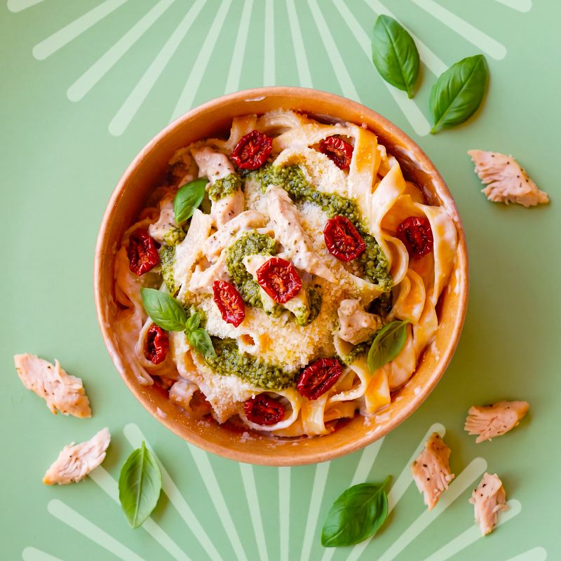 Fettuccine Pesto e Pollo with creamy chicken, basil pesto and sun-dried tomatoes